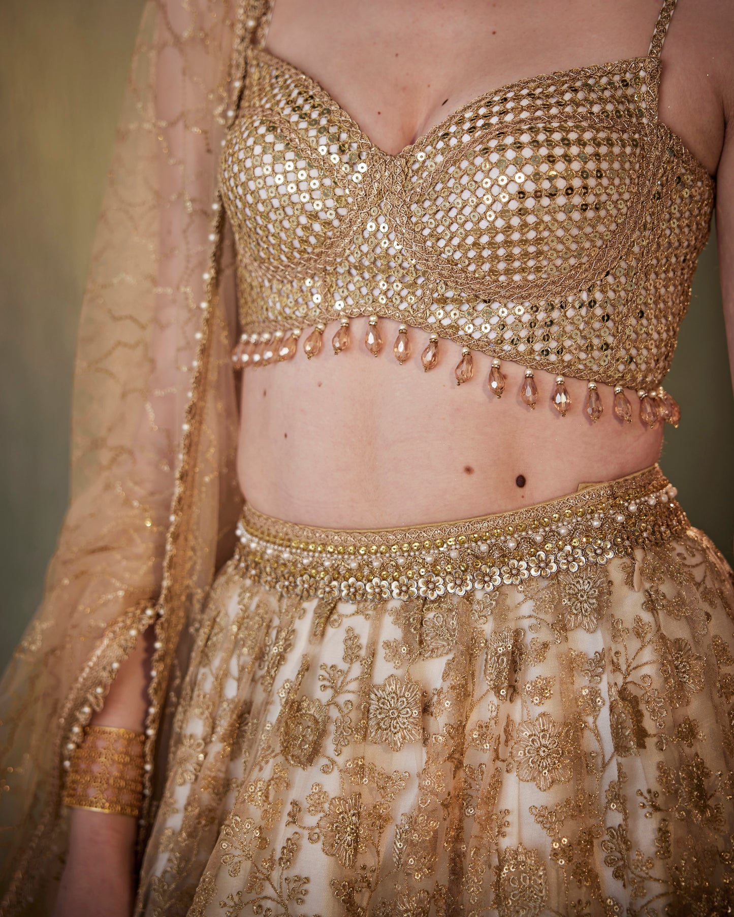 Ivory gold embroidered tulle lehenga