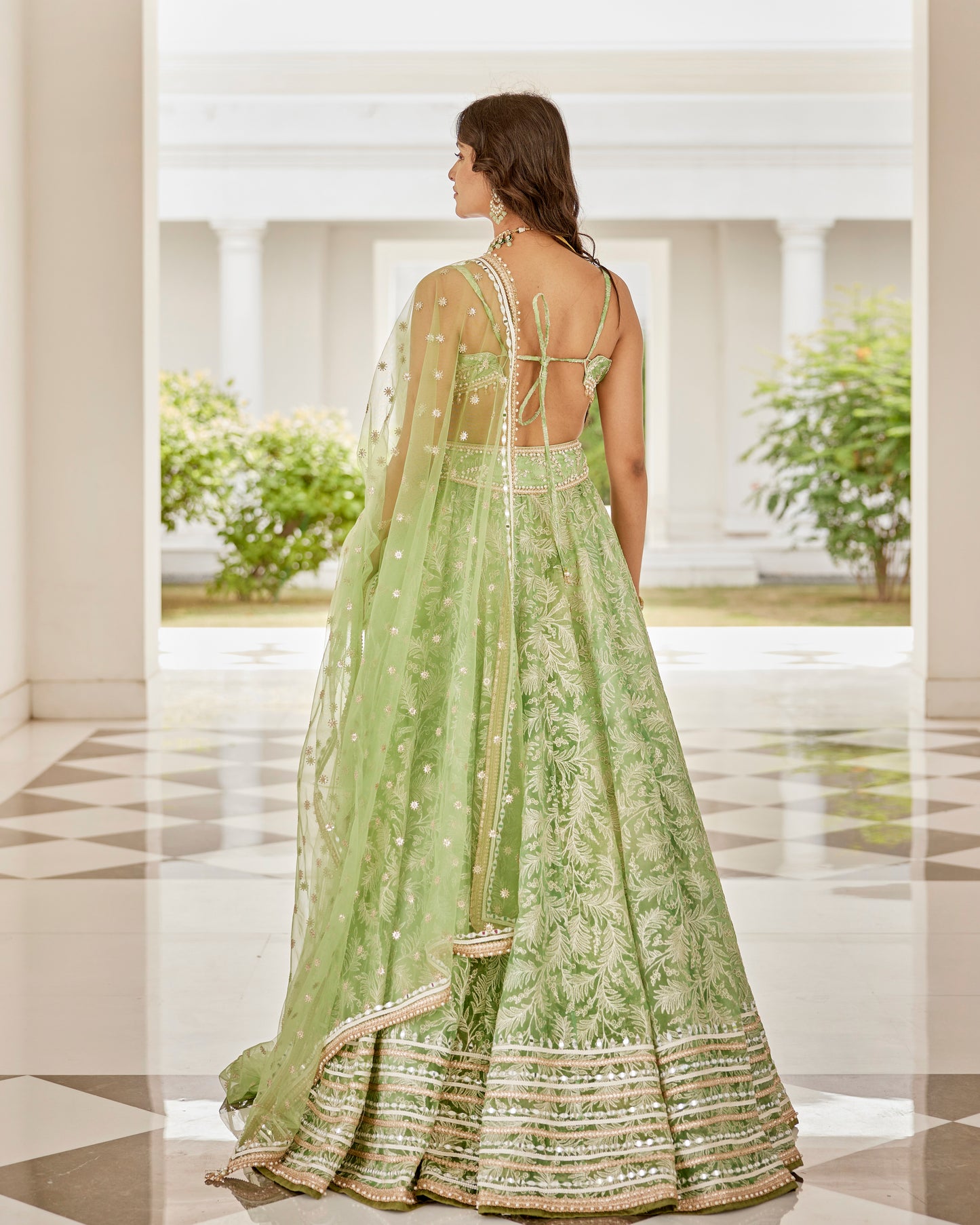 Mint green leaves organza lehenga