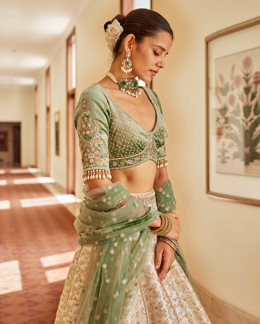 Ivory kalidaar lehenga with velvet blouse