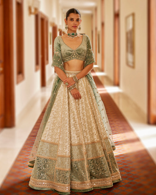 Ivory kalidaar lehenga with velvet blouse