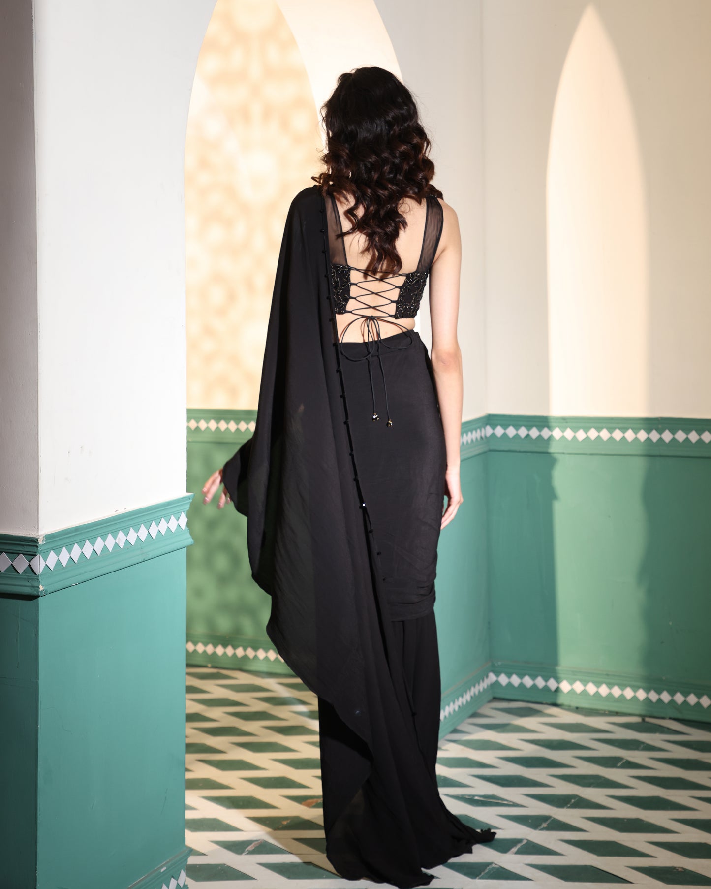 Black drape saree with embroidered blouse