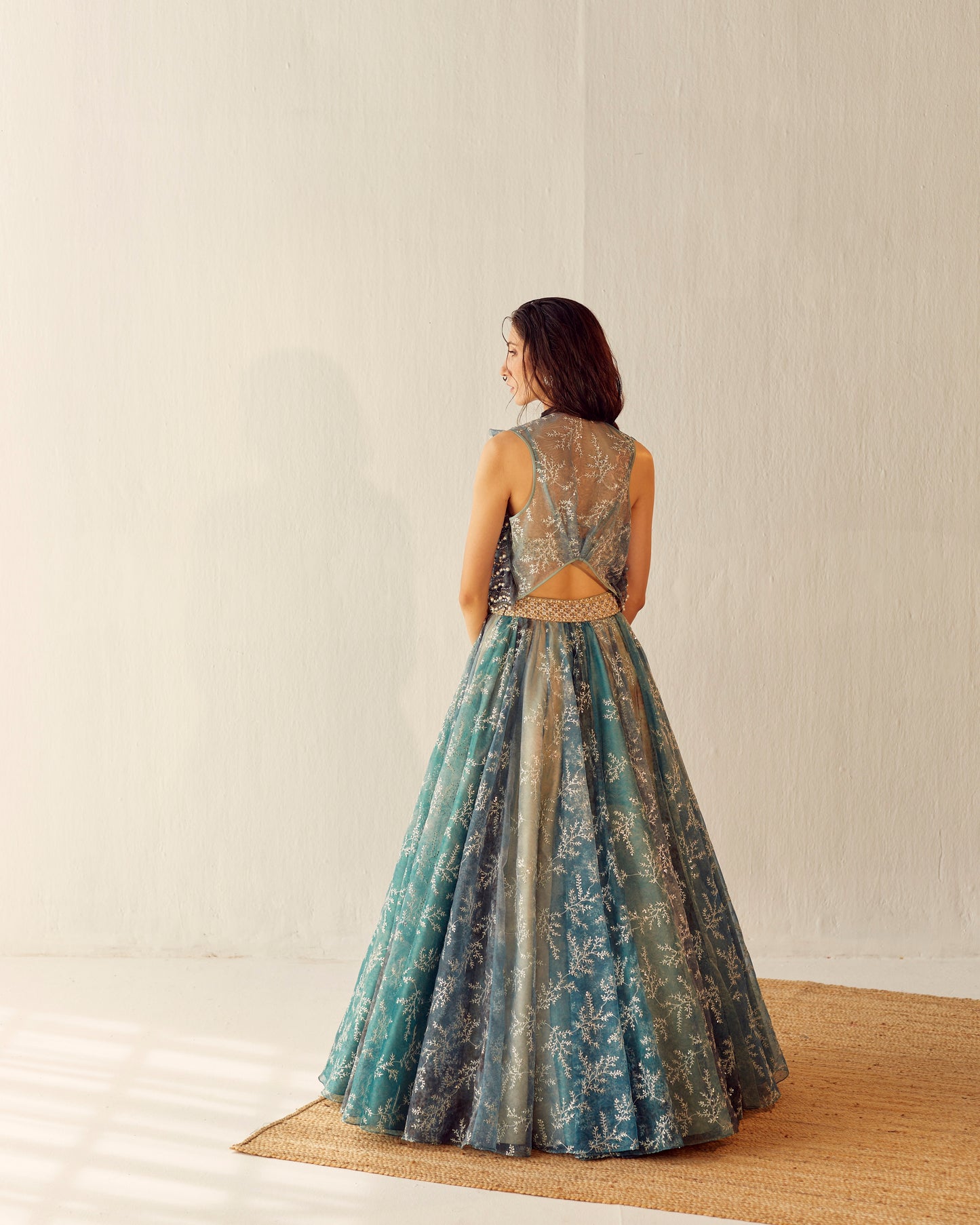 Lake blue organza lehenga with embroidered gilet
