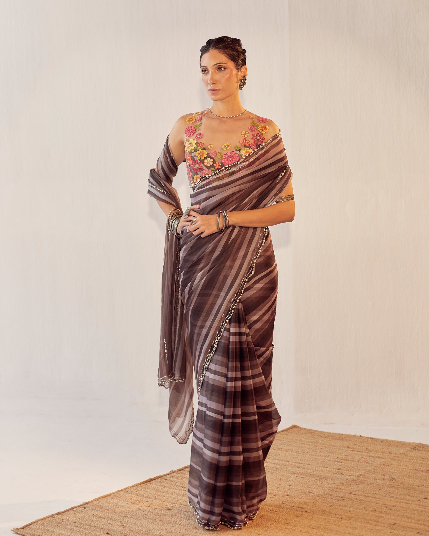 Organza saree with colored floral blouse