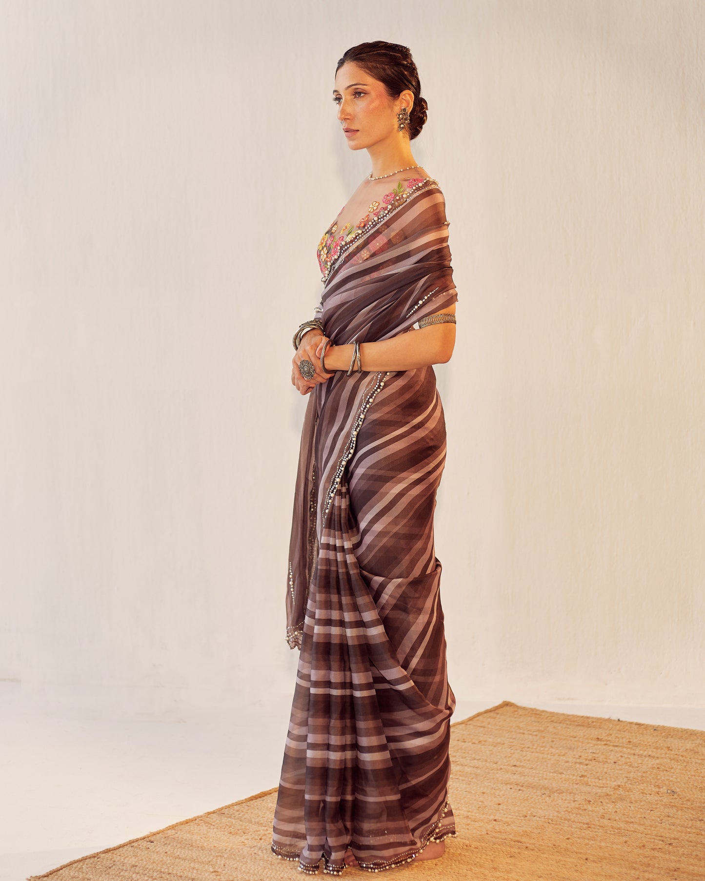 Organza saree with colored floral blouse