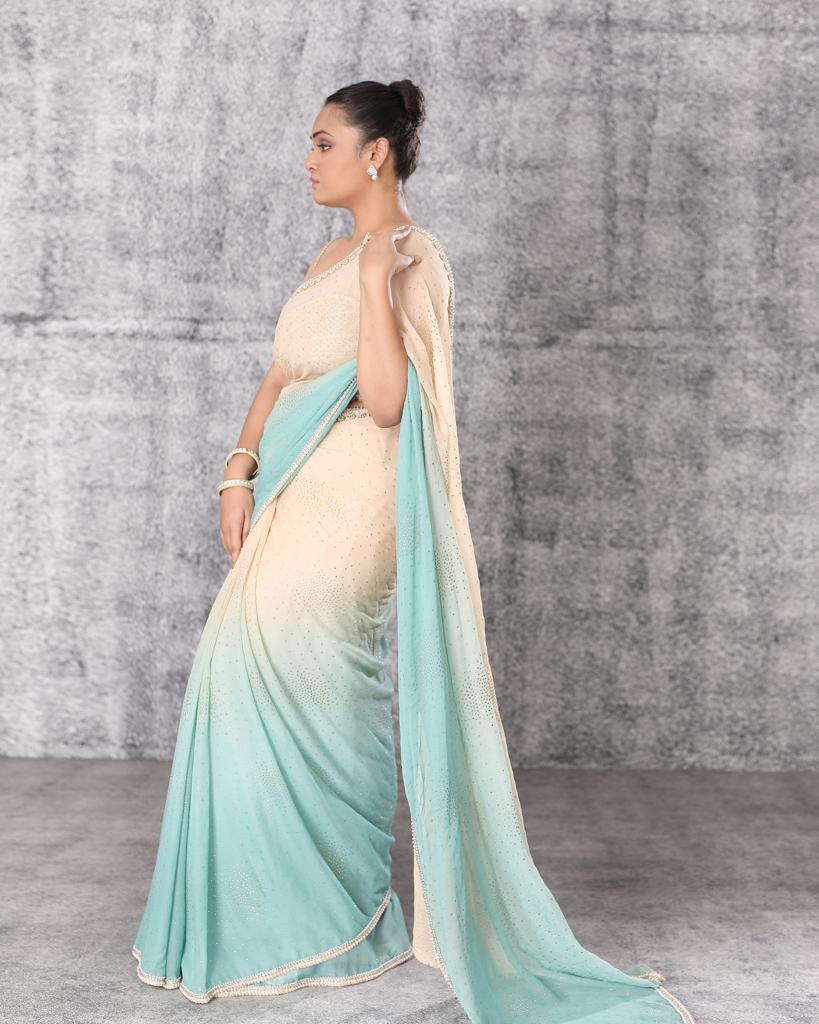 Ombré shaded georgette saree with gold corset blouse