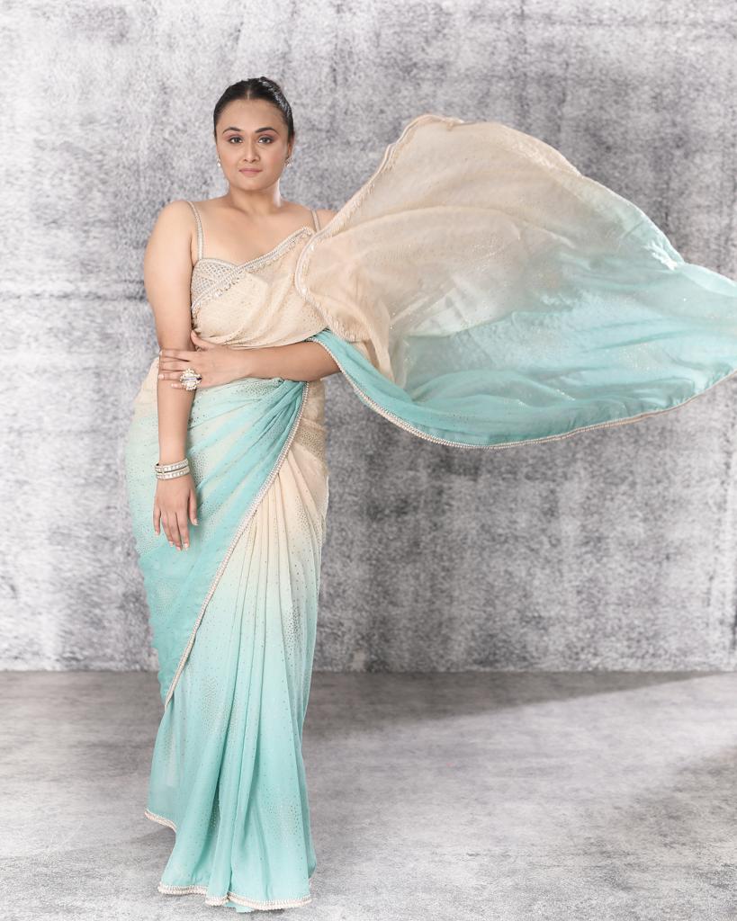 Ombré shaded georgette saree with gold corset blouse
