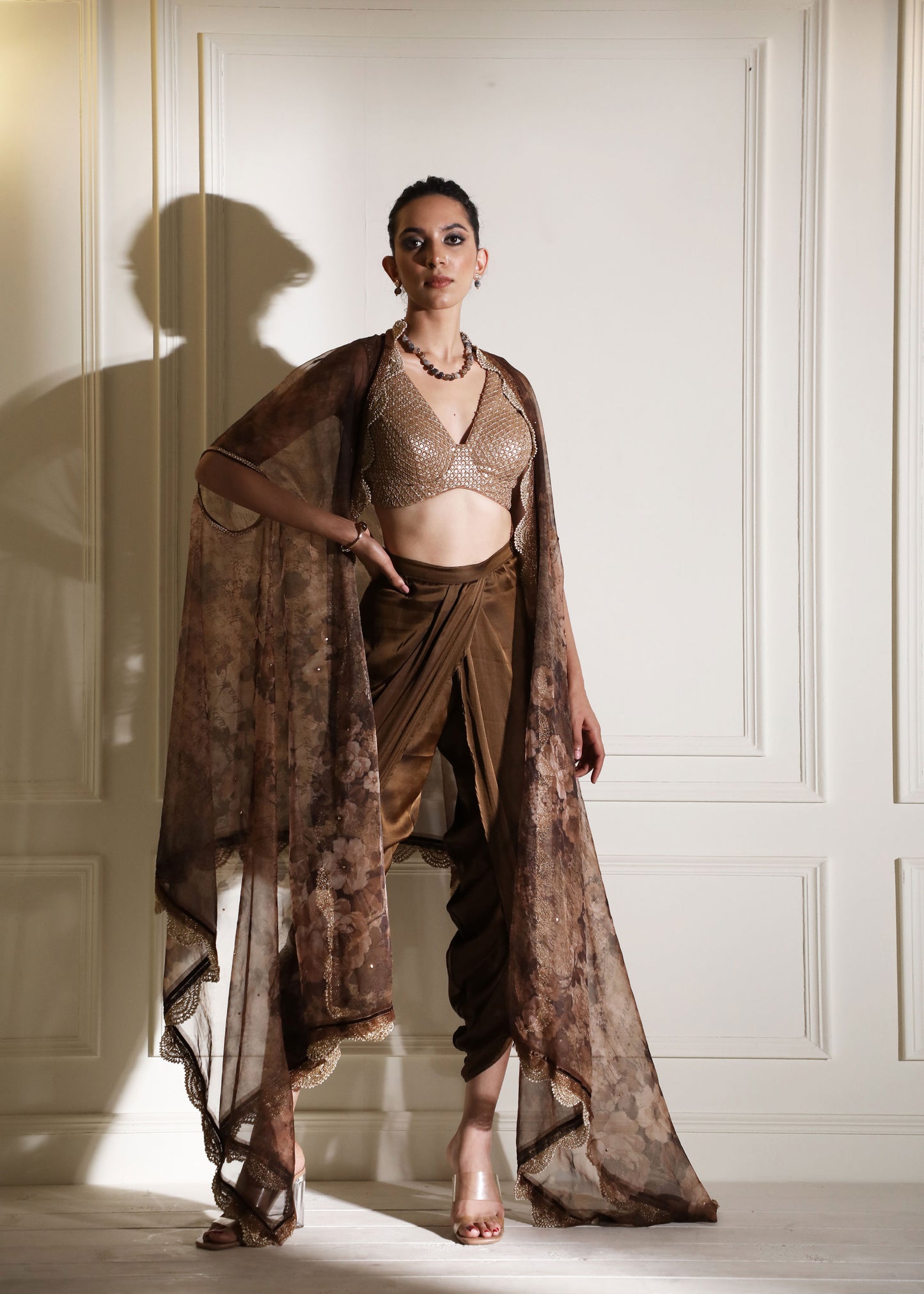 Brown dhoti pants with sequin blouse and organza cape