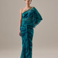 Woman wearing a teal one-shoulder dress with a plain background