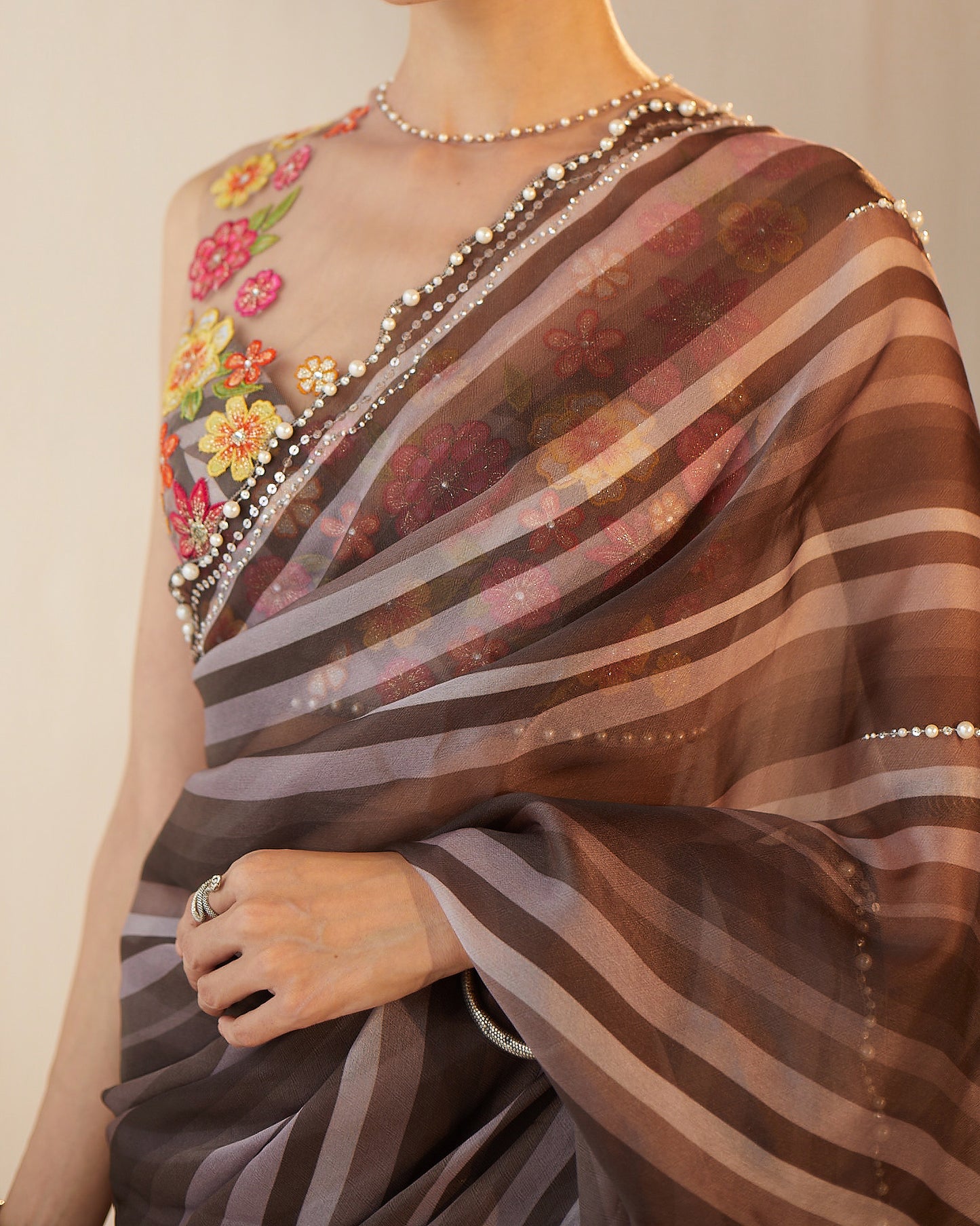 Organza saree with colored floral blouse